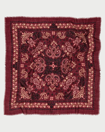 Maison Lecomte Flament Bandana Scarf Salem in square burgundy with a black and cream paisley and floral pattern and a raw, frayed edge.