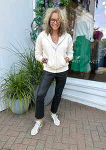 Frame le crop mini boot leather pants and Perfect White Tee sweatshirt worn by Westport ct boutique owner Kitt Shapiro 