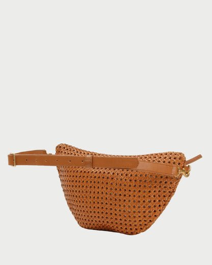 Brown woven belt bag with a tan leather strap on a white background