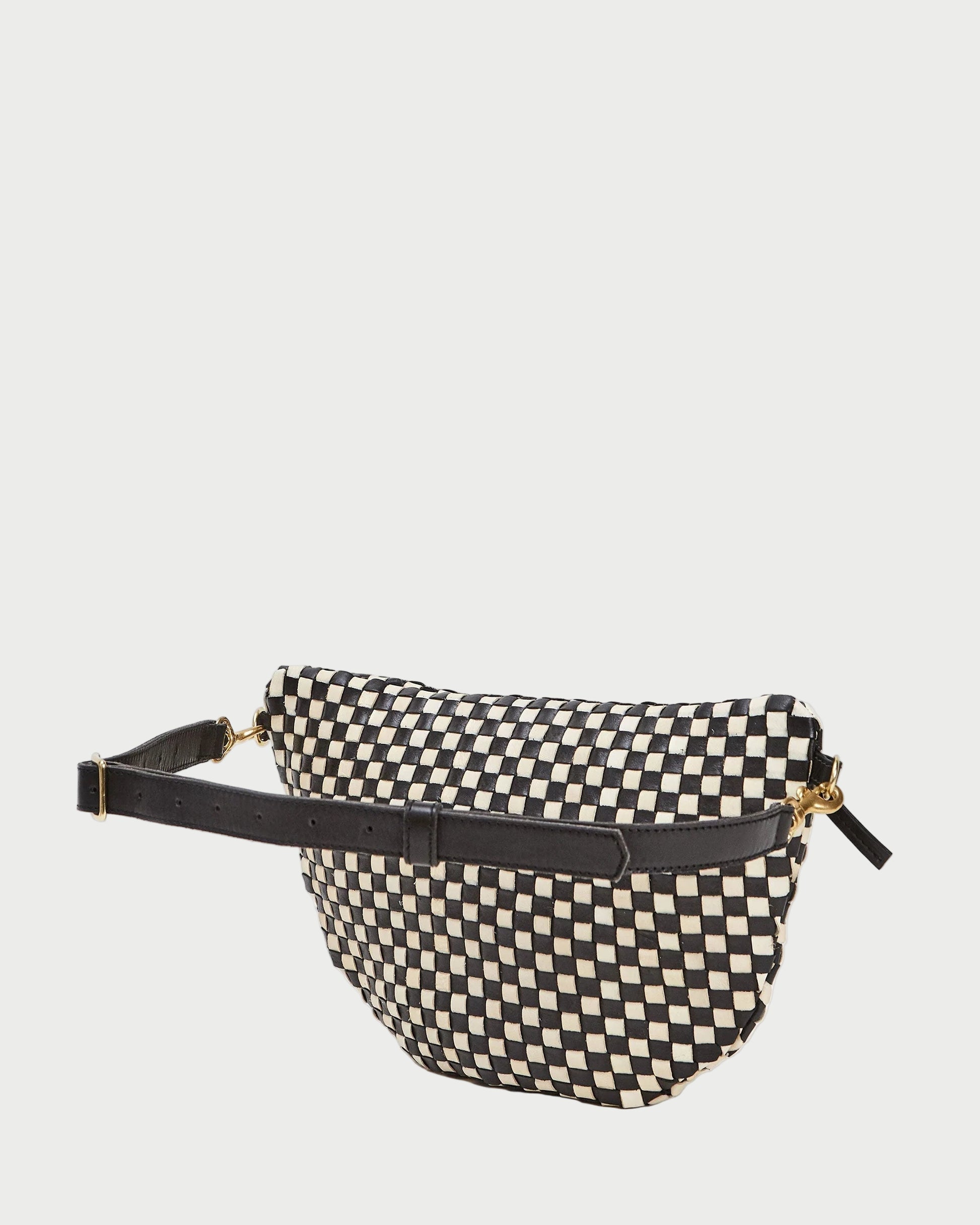 Black and white checkered fanny pack with a gold zipper on a white background