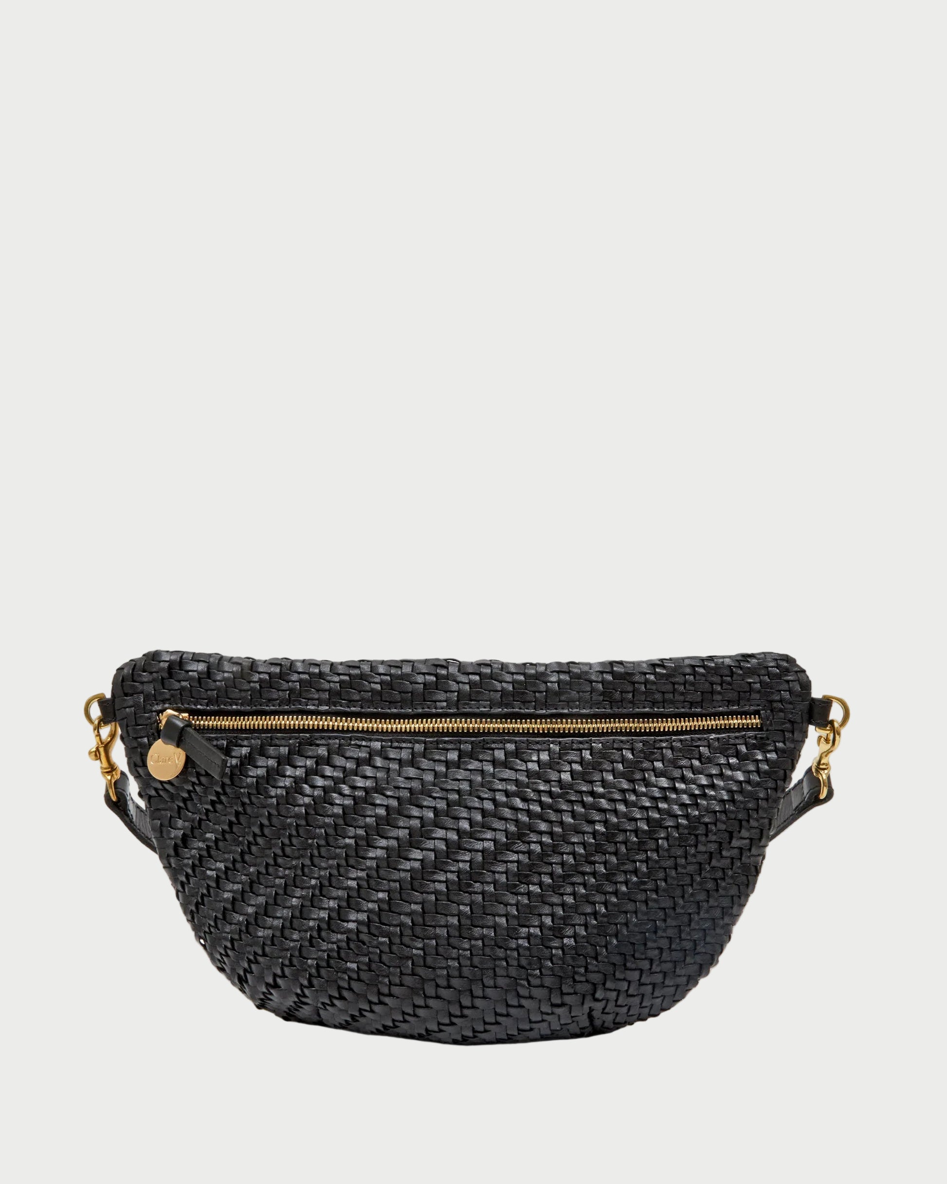 Black woven belt bag with gold zipper and chain on a white background