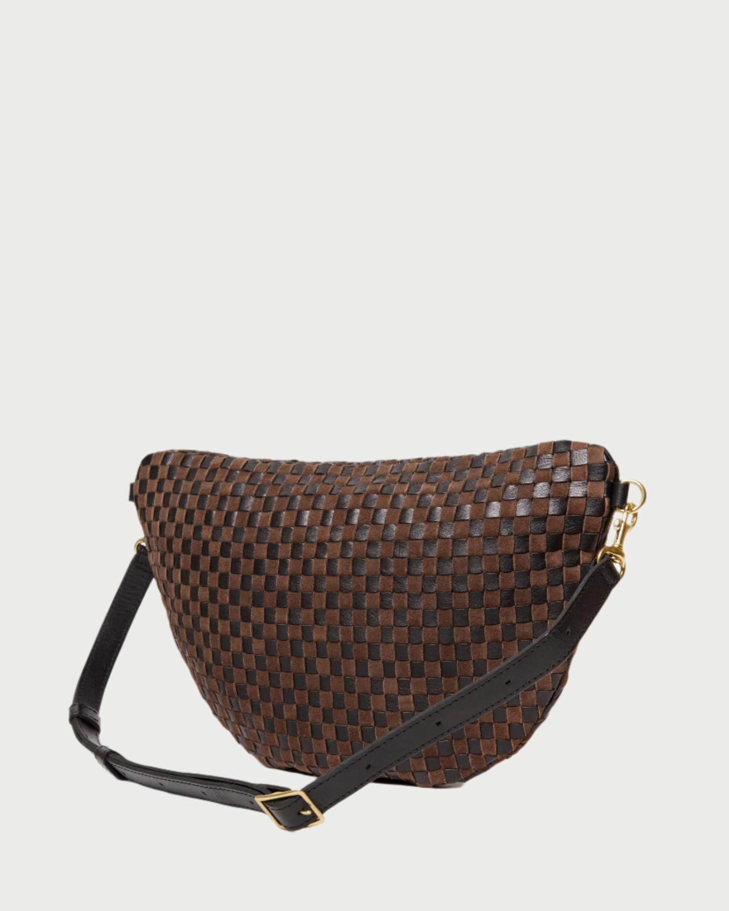Brown woven handbag with a black strap on a light gray background
