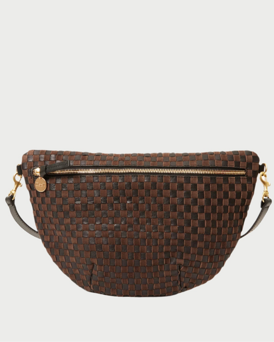Brown woven handbag with gold zipper on a white background