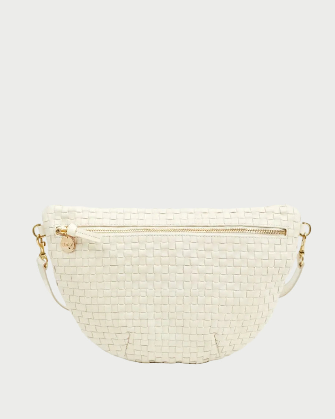 A CLARE V. Cream Woven Grande Fanny, featuring handwoven leather in a creamy hue, gold hardware, a gold zipper, and a round gold charm on the zipper pull, is displayed against a plain light background.