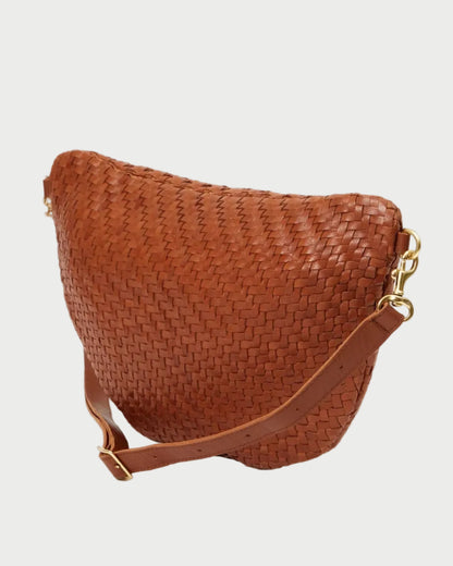 Brown woven handbag with a gold clasp on a white background