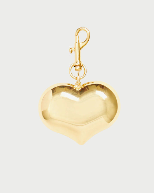 Gold heart-shaped charm on a white background