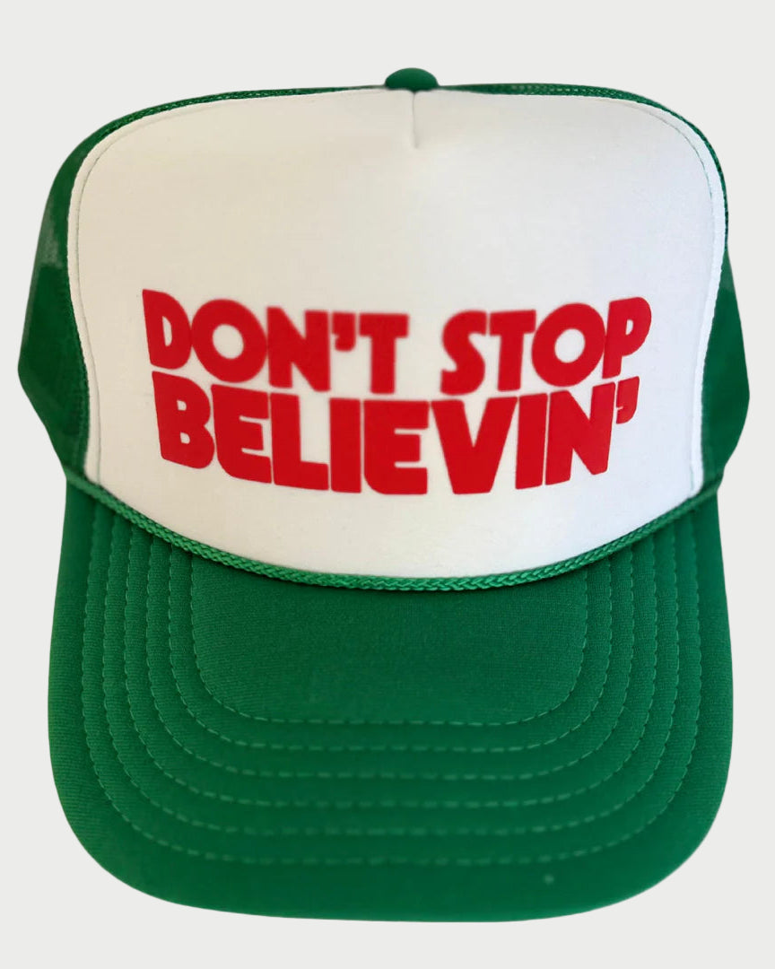 Green and white cap with red text 'DON'T STOP BELIEVIN'' on a white background