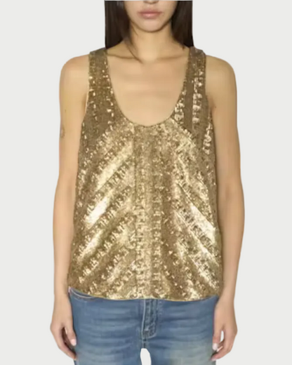 A woman wearing a sleeveless gold sequin tank top with a scoop neckline, paired with blue jeans, shown against a plain white background.