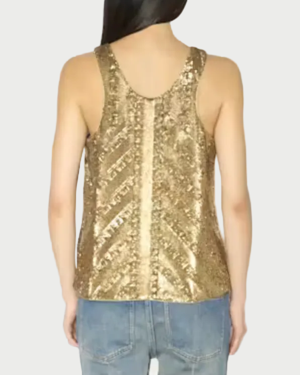 A woman shown from the back wearing a sleeveless gold sequined top with a V-neck and light blue jeans, against a plain white background.