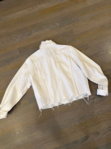 rear view of Frame vintage distressed denim jacket in white at west2west2westport.com