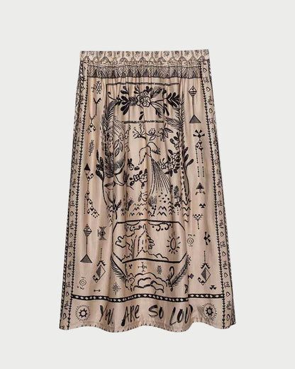 Skirt with black patterns and text on a beige background