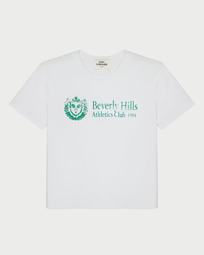 The BH Athletic Club Everyday Tee by Sunny Somewhere is a white, boxy-fit tee with green "Beverly Hills Athletic Club 1984" text and a crest emblem, plus a classic crew neck and short sleeves for a vintage look.