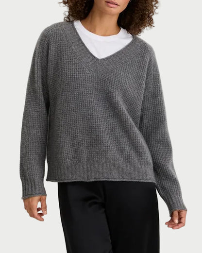 One Grey Day Linden Cashmere V-Neck in grey ribbed knit worn over a white crew-neck t-shirt.