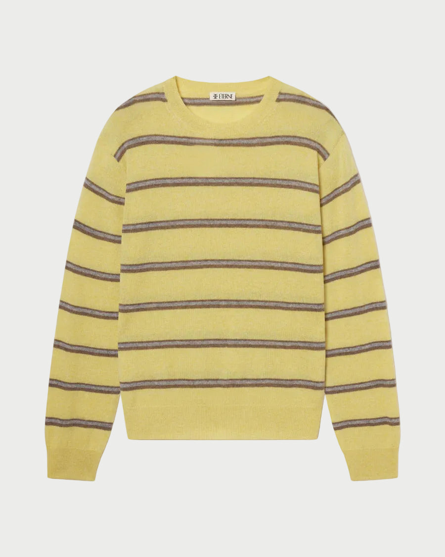 Yellow sweater with brown stripes on a white background