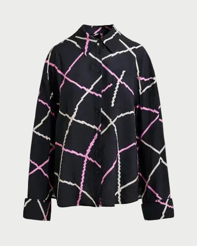Black shirt with pink and white abstract pattern on a light gray background