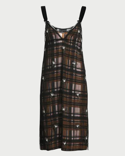 A sheer black mesh slip dress with a brown and black plaid pattern, featuring small white embroidered flowers and black shoulder straps, shown against a plain white background.
