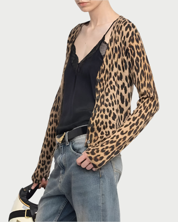 Person wearing a leopard print shirt, black top, and jeans on a white background