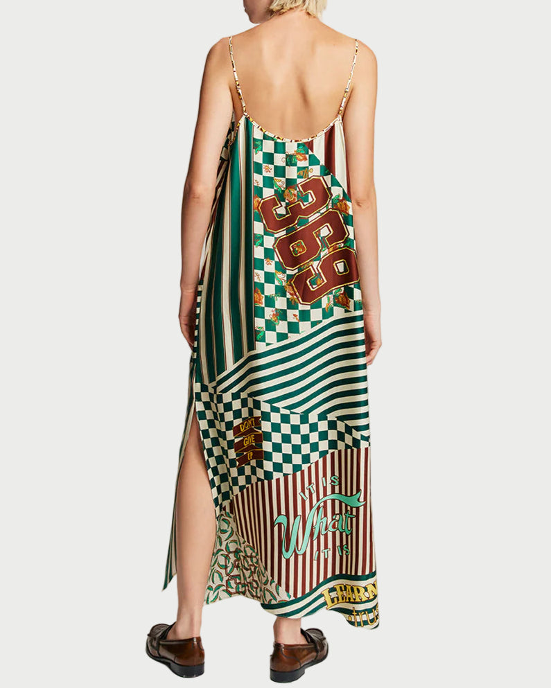 Woman wearing a colorful patterned dress with a white background