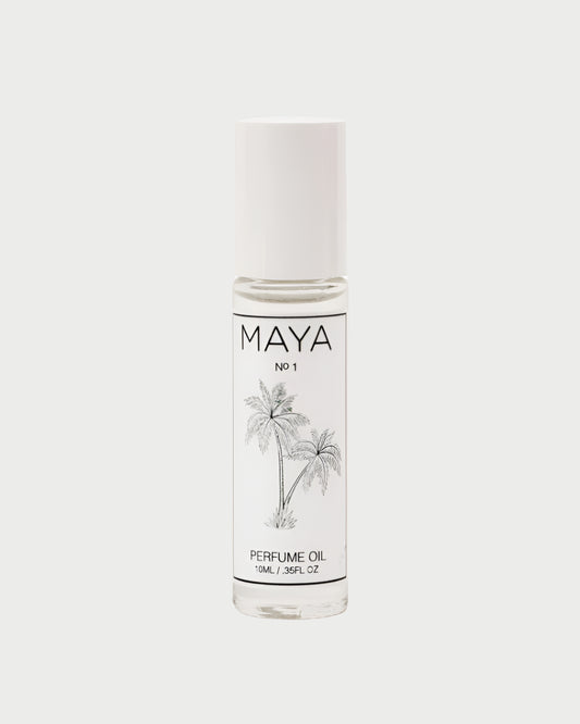 A clear glass bottle of MAYA 1 10ML perfume oil by MAYA, featuring a white cap, minimalist black text, and palm tree illustration. This 10 mL (0.35 fl oz) scent emphasizes personalization and sustainability in design.