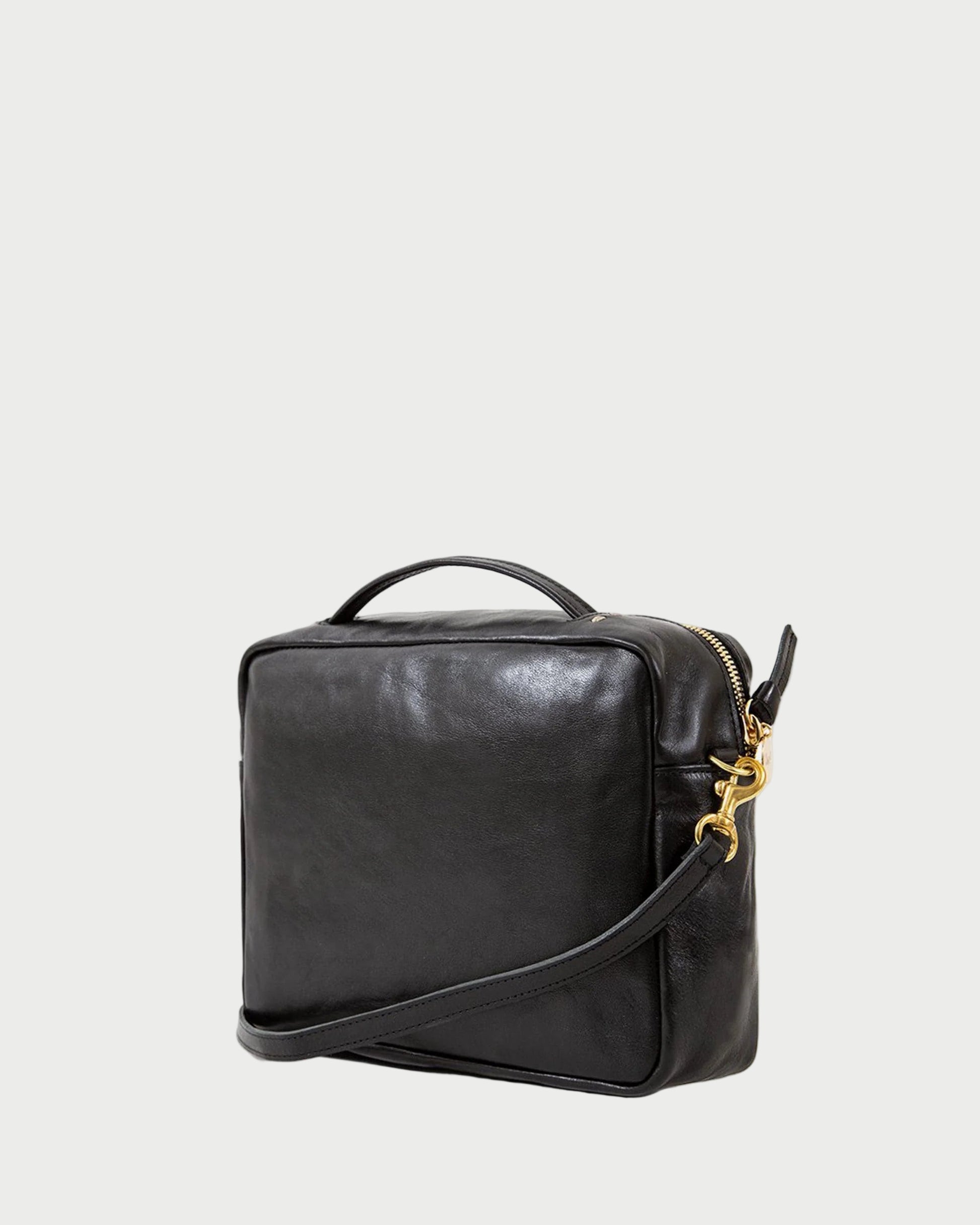Black leather bag with gold zipper on a white background