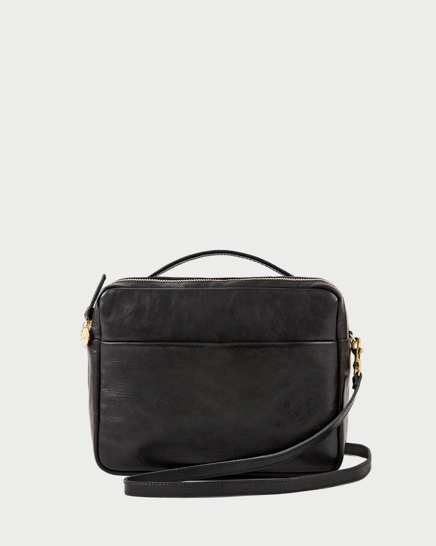 Black handbag with a shoulder strap on a white background