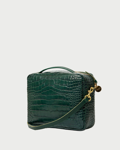 Green crocodile-patterned handbag with a gold chain on a white background