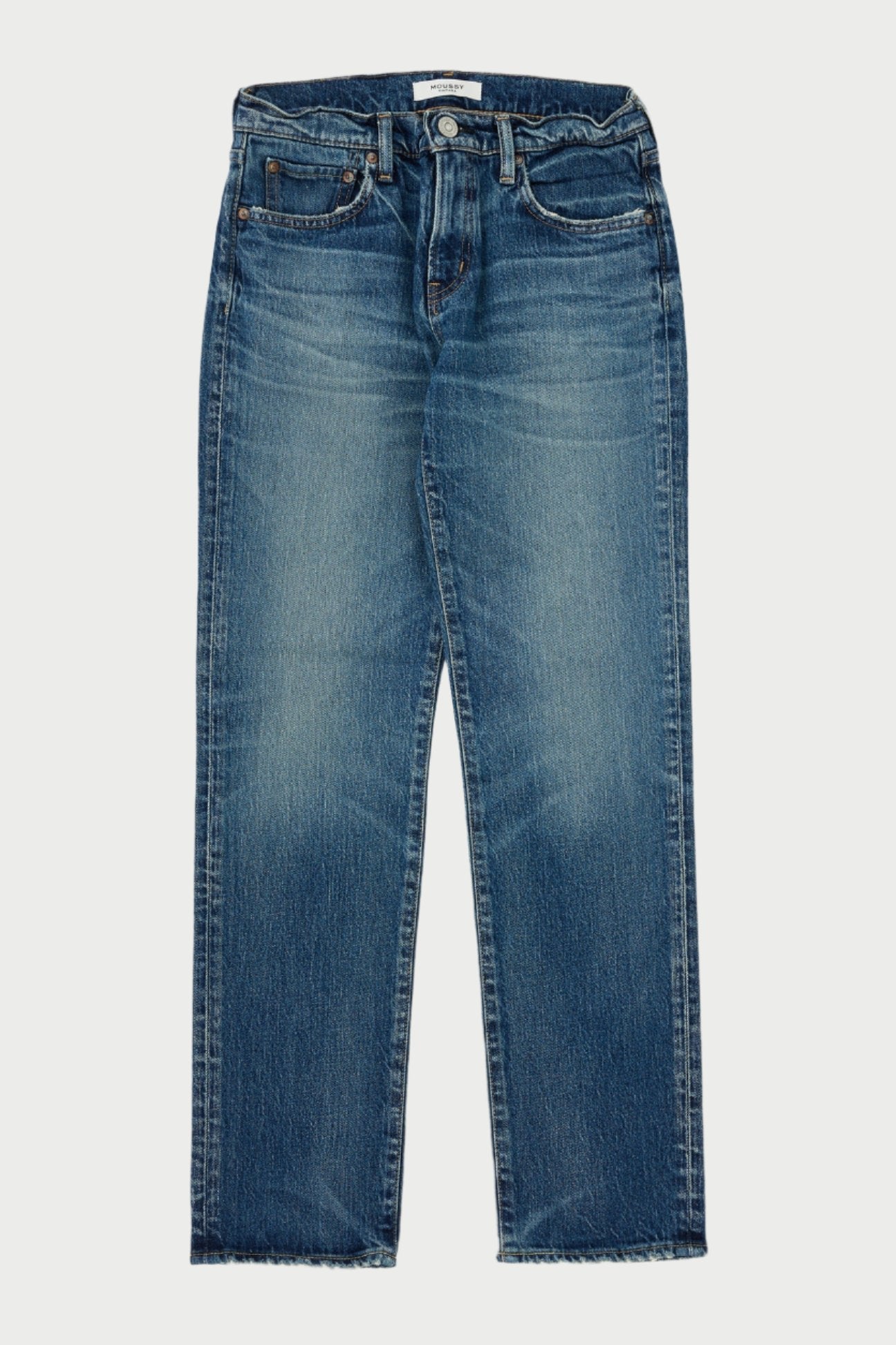 Introducing the Florahome Slim Straight Jeans by Moussy: a blue mid-rise denim pair with a timeless five-pocket design. These jeans boast a faded wash and frayed hems, creating an effortlessly stylish look when displayed flat against a plain background.