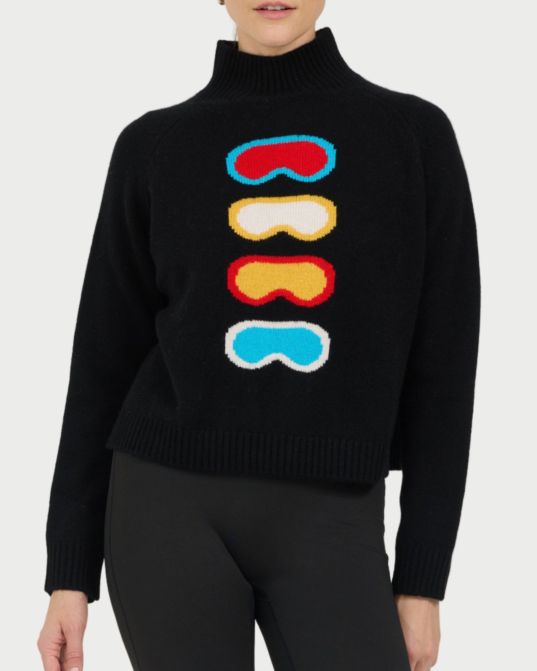 Black sweater with colorful goggles design worn by a model on a white background