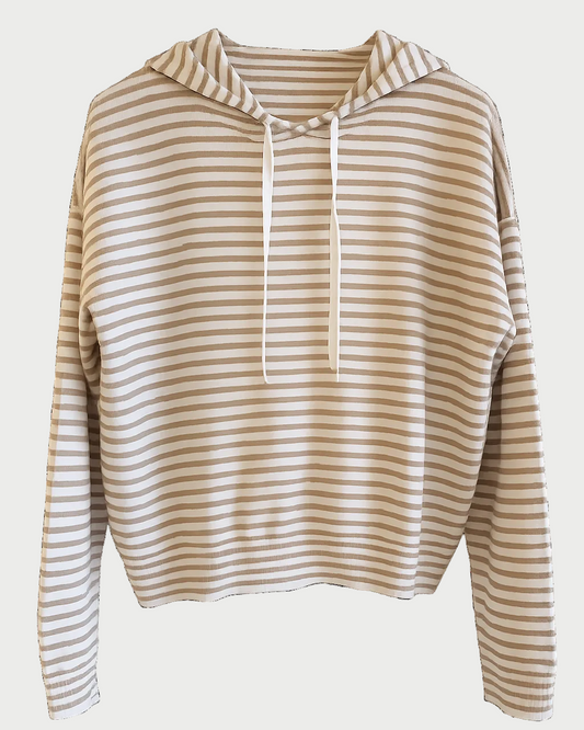A cropped long-sleeve hoodie with horizontal beige and white stripes, featuring a matching beige drawstring hood, shown against a plain white background.