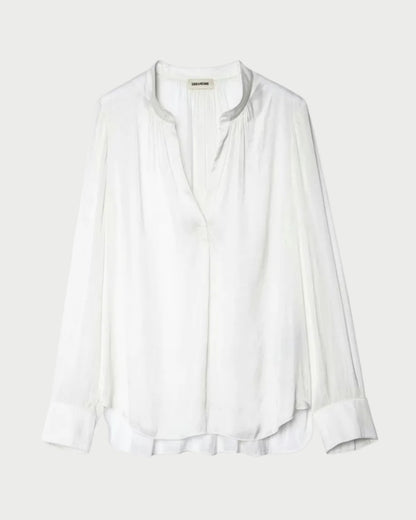 White blouse on a light gray background