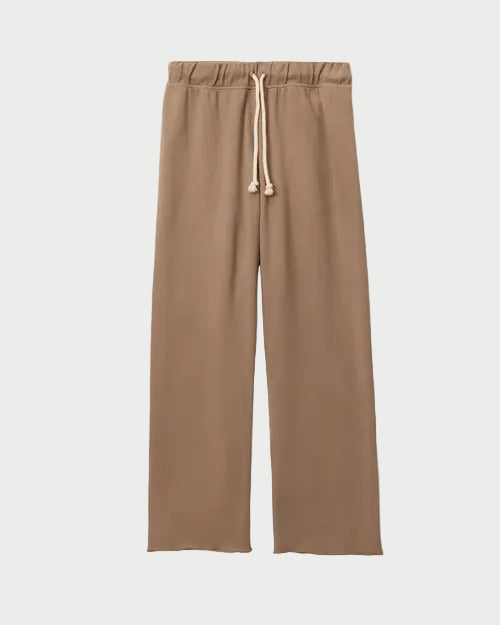 Tan pants with a drawstring on a white background
