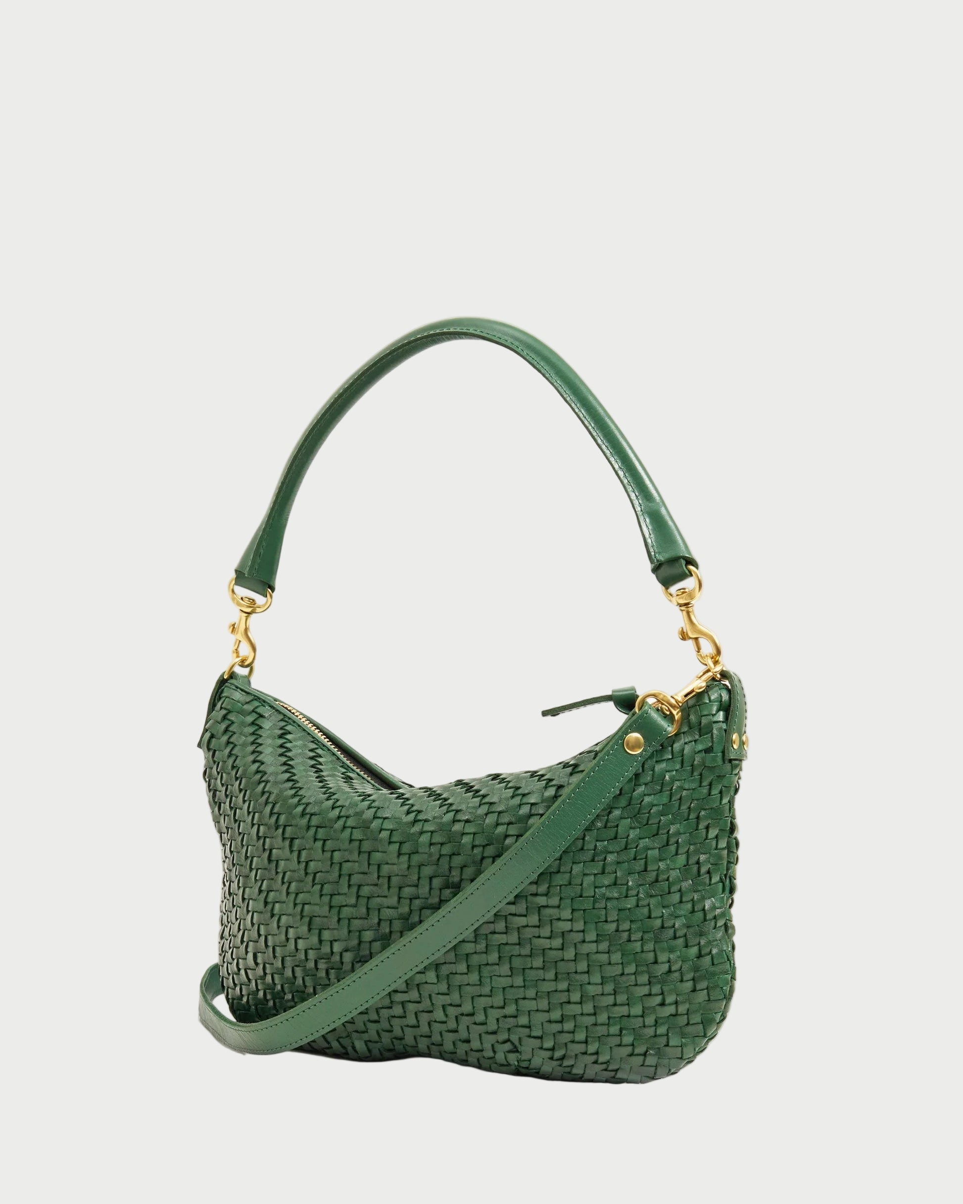 Green woven handbag with gold accents on a white background