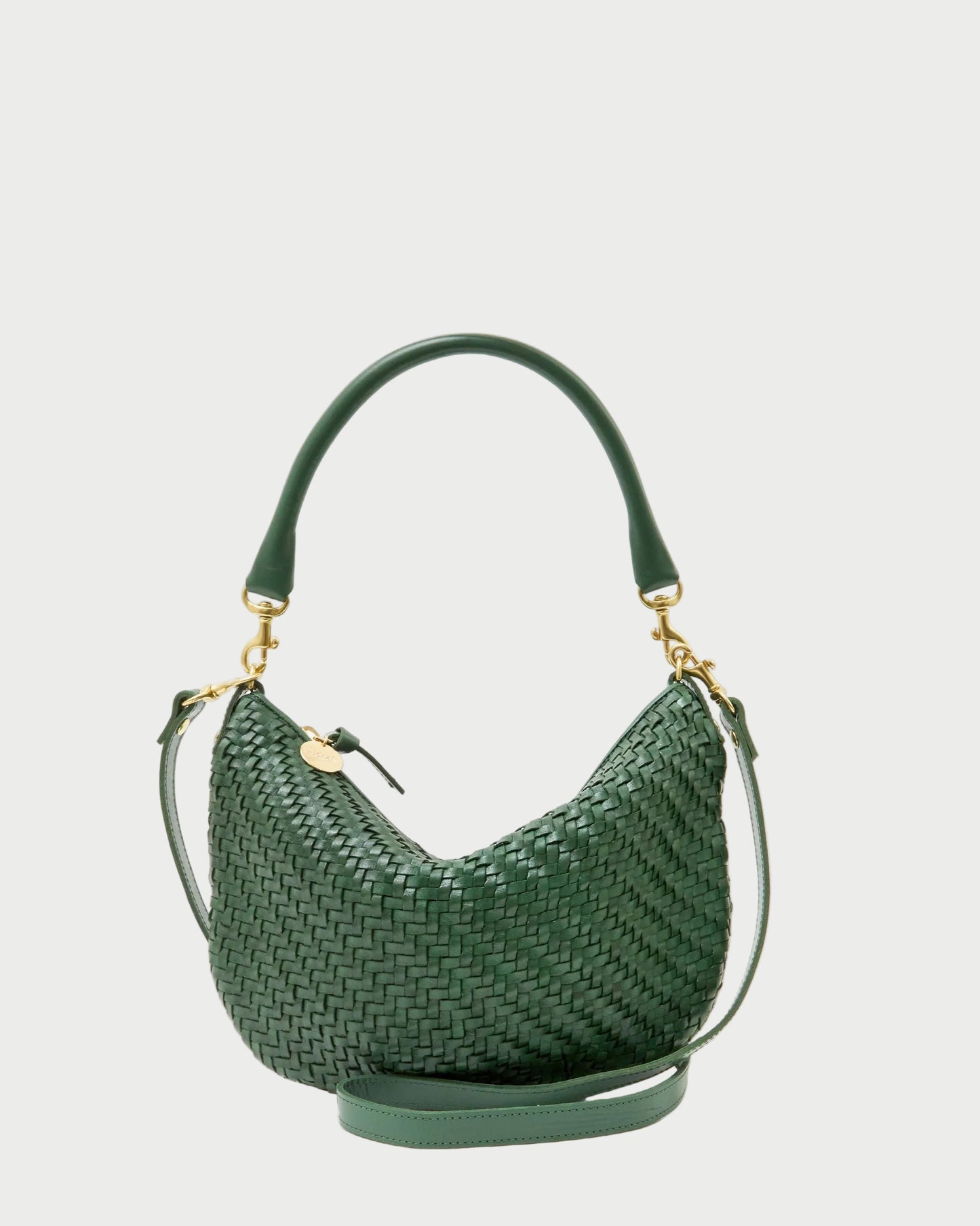 Green woven handbag on a white background