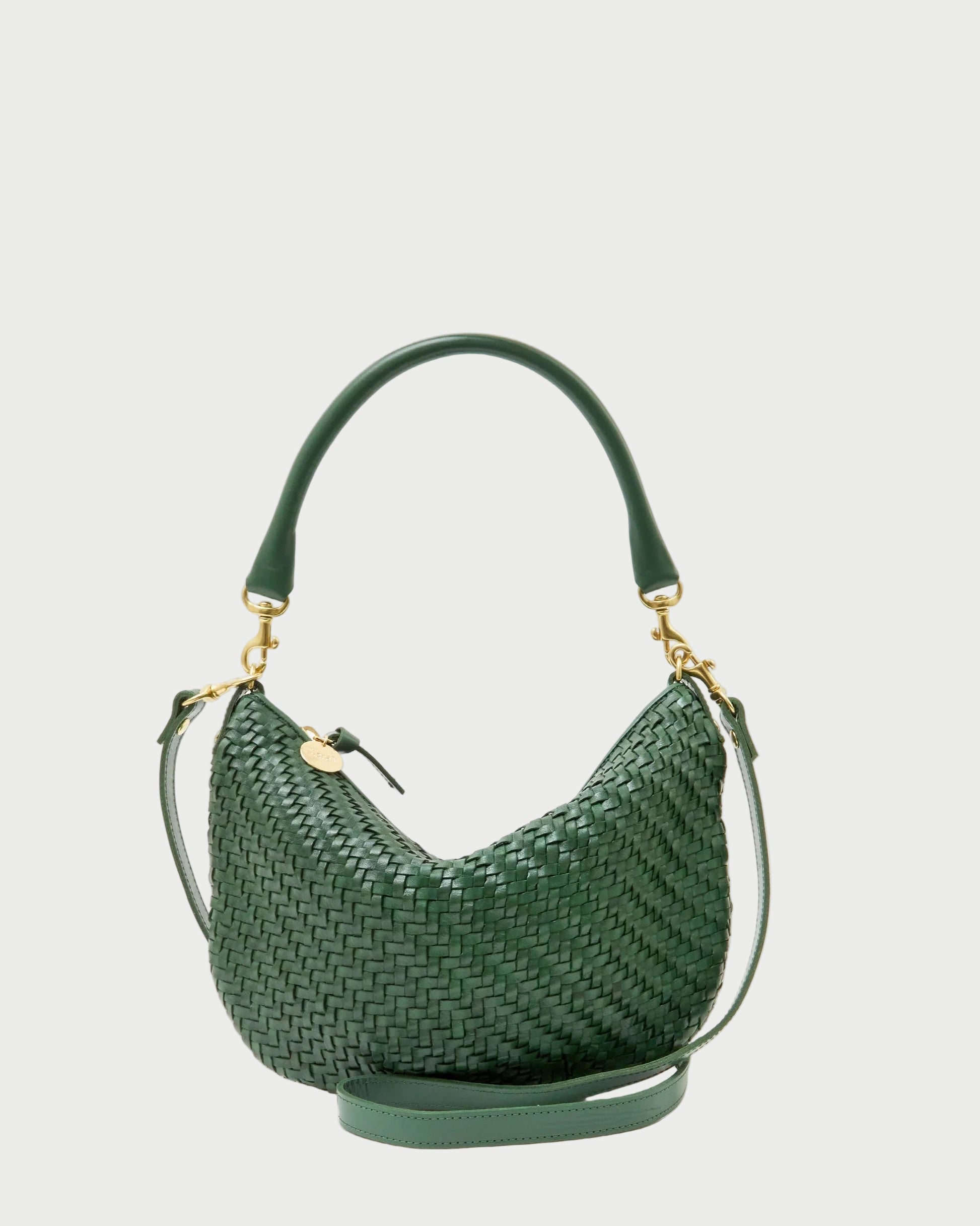Green woven handbag on a white background