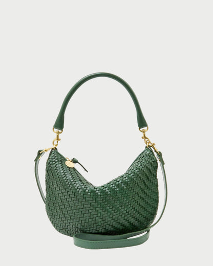 Green woven handbag on a white background
