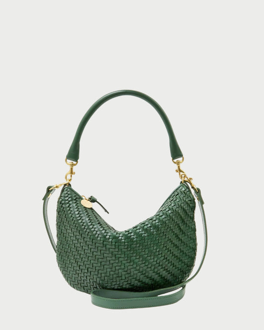 Green woven handbag on a white background
