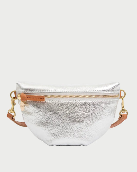 Silver metallic fanny pack with gold zipper and strap on a white background