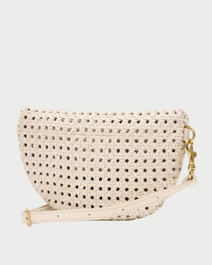 The CLARE V. Clare V. Petite Fanny Rattan is a small, half-moon shaped handwoven leather bag in beige, featuring a matching adjustable strap and elegant gold hardware, displayed on a plain white background.