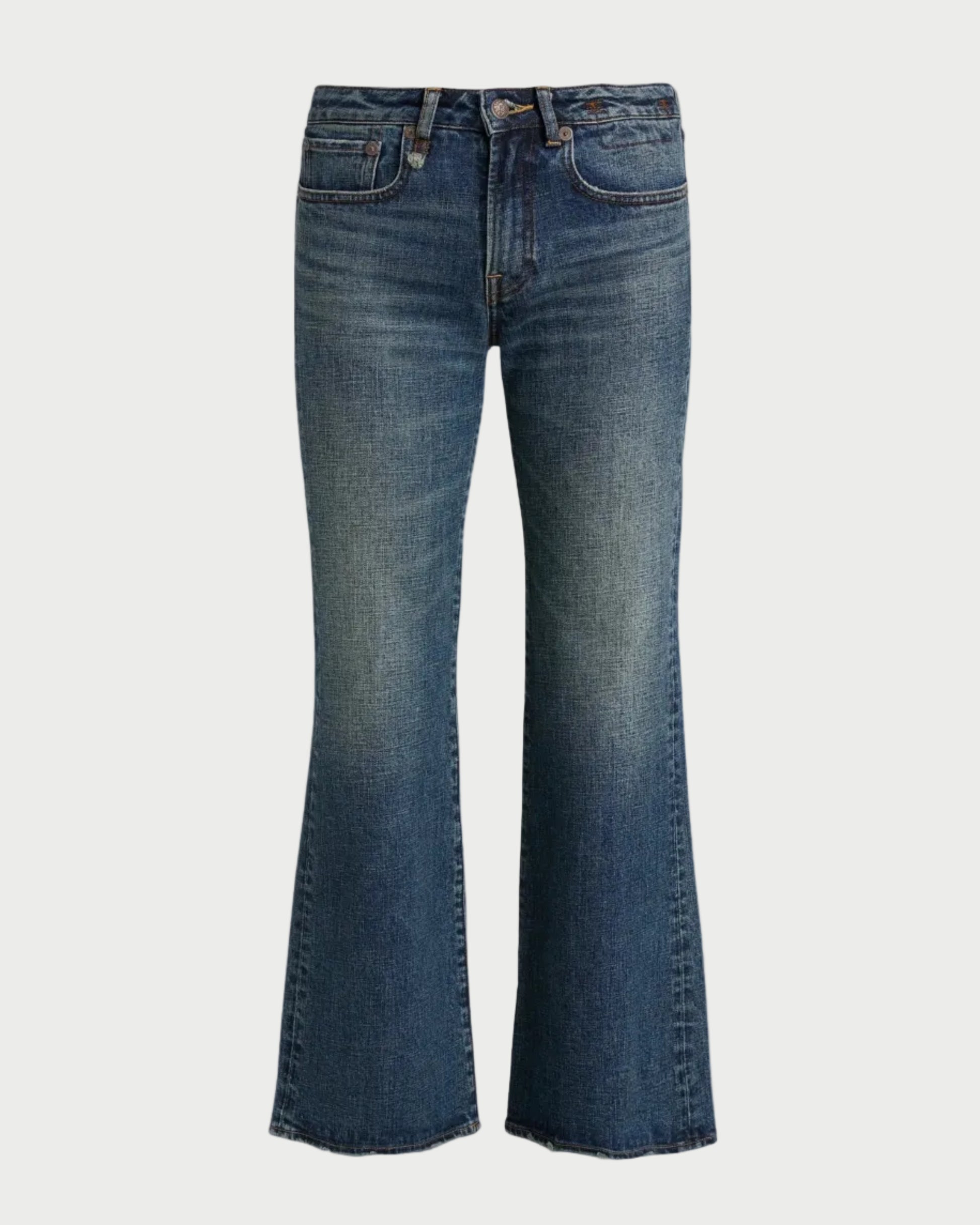 A pair of medium-wash blue denim flare jeans shown flat against a solid white background.