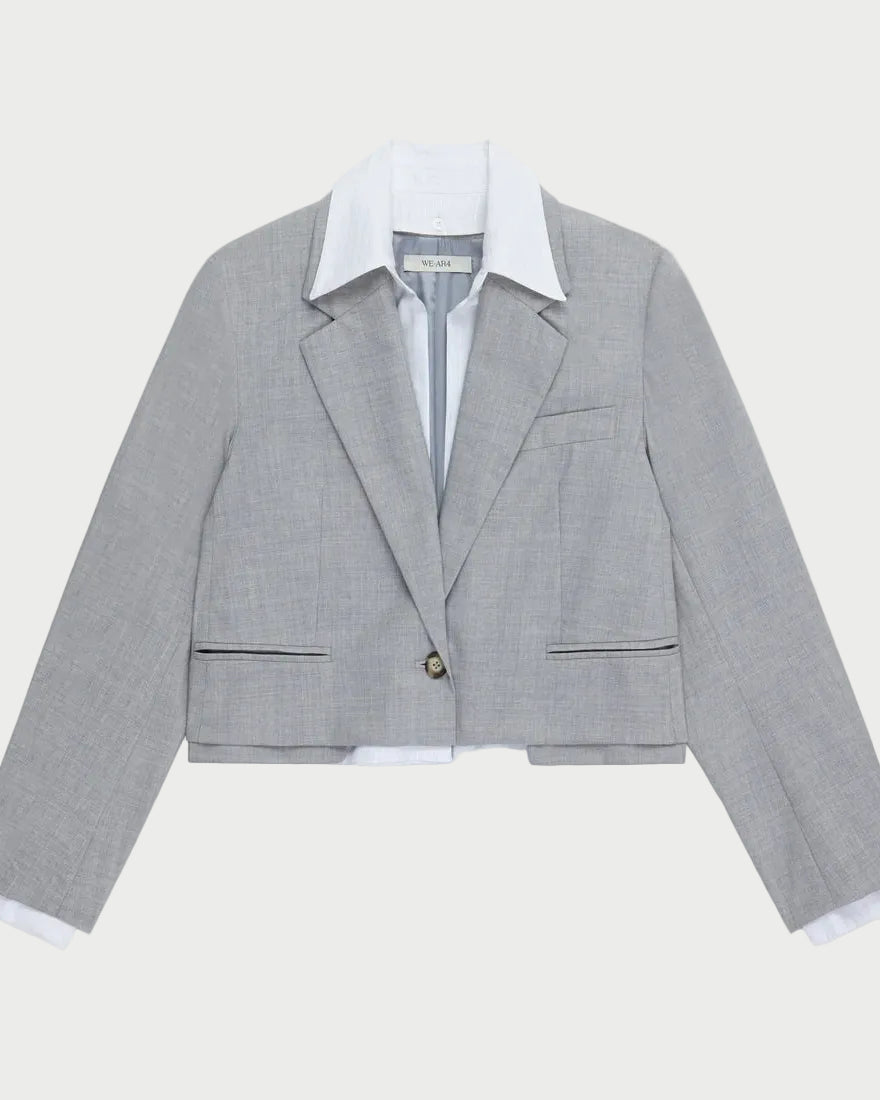 Gray checkered blazer with white shirt on a light gray background