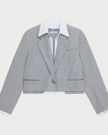 Gray checkered blazer with white shirt on a light gray background