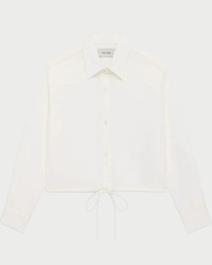 White blouse with long sleeves on a white background