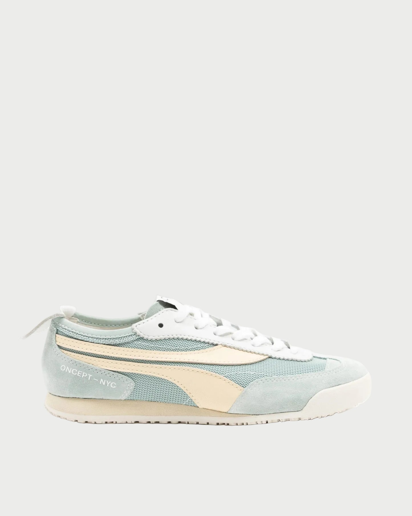The lightweight Oncept Reno Sneaker by Oncept features light blue and cream colors, white laces, a cream side stripe, and "ONCEPT - NYC" text near the heel, shown on a plain light background.