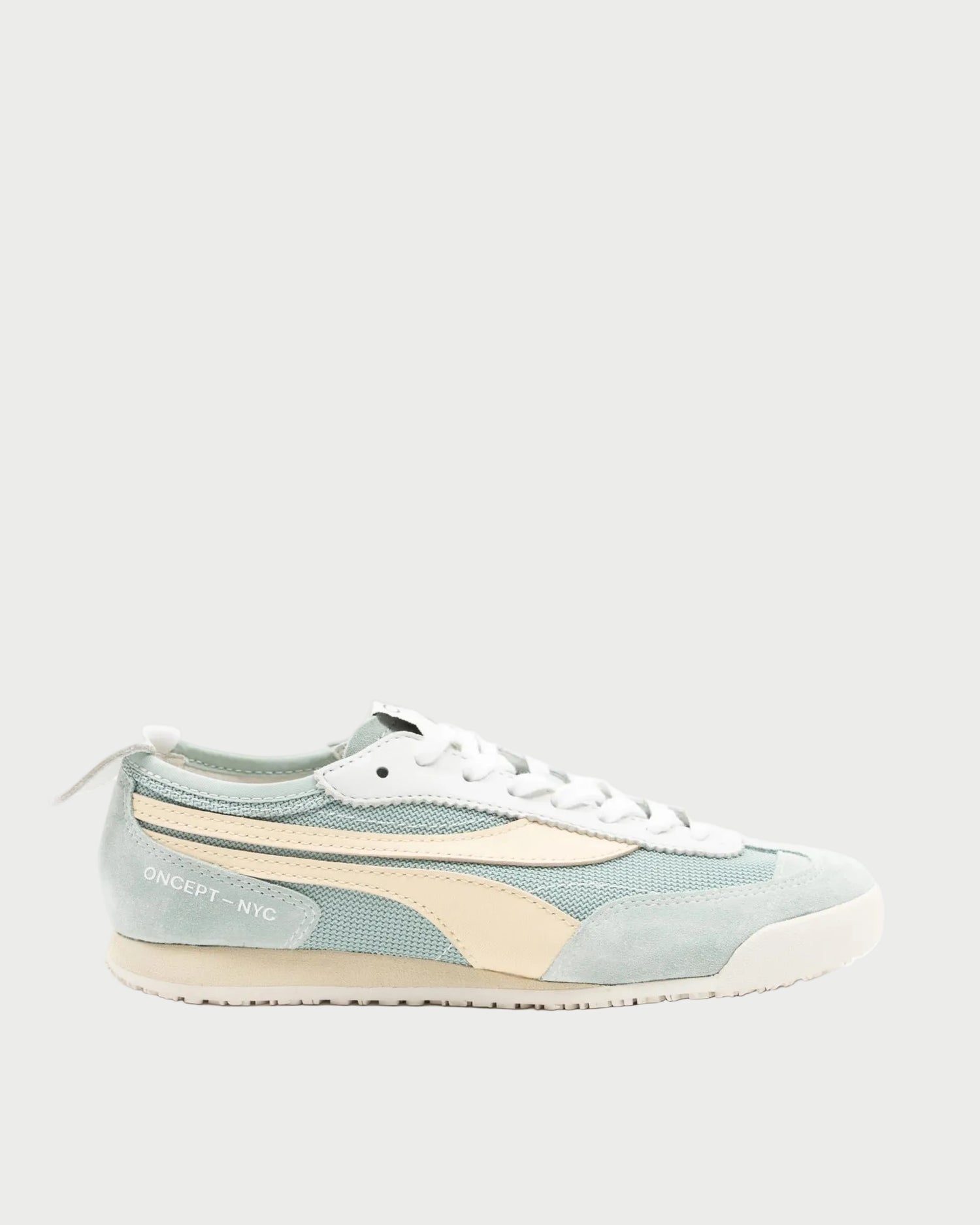 The lightweight Oncept Reno Sneaker by Oncept features light blue and cream colors, white laces, a cream side stripe, and "ONCEPT - NYC" text near the heel, shown on a plain light background.