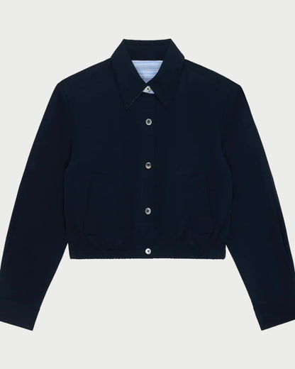 Navy blue jacket with button details on a light gray background