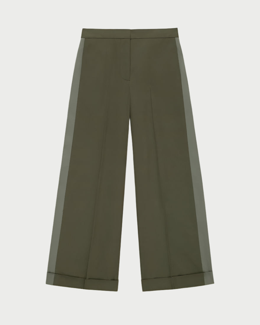 WE-AR4 Field Trouser in olive green, made from upcycled cotton, features a high waist and subtle front crease. These wide-leg pants have a darker green side stripe and cuffed hem, displayed on a light background.