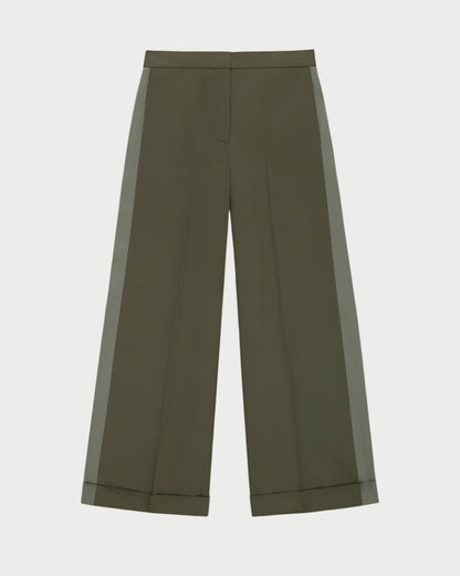WE-AR4 Field Trouser in olive green, made from upcycled cotton, features a high waist and subtle front crease. These wide-leg pants have a darker green side stripe and cuffed hem, displayed on a light background.