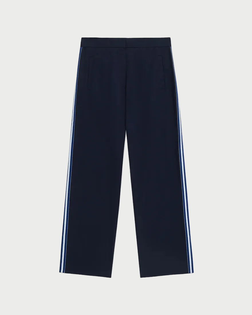 Navy pants with white stripes on a light gray background