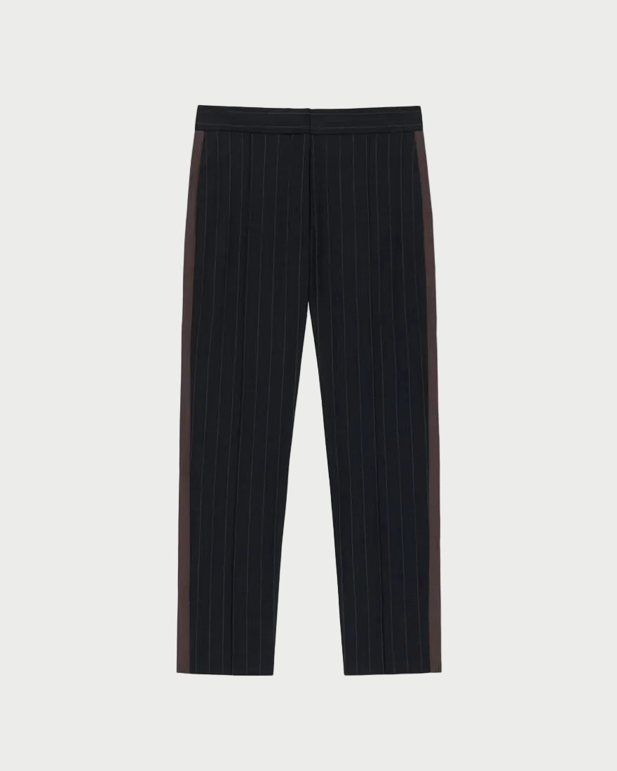 The WE-AR4 Windsor Trouser by WE-AR4 showcases black pinstripes and dark brown side panels in a tapered straight-leg silhouette, crafted from upcycled wool and laid flat on a white background—these limited edition trousers embody both sustainability and timeless style.