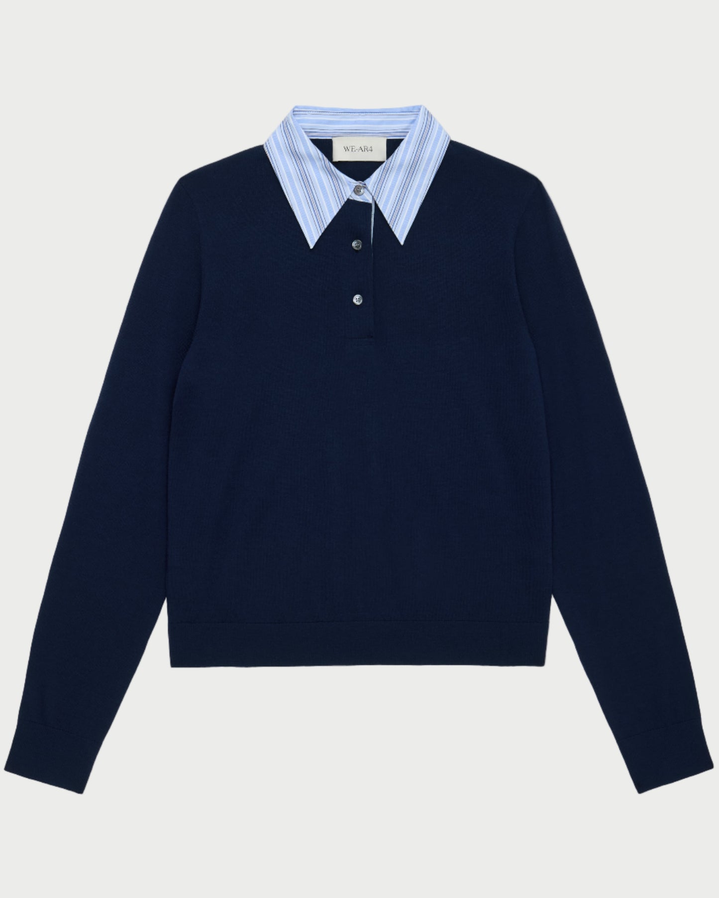 The WE-AR4 Charlie Polo by WE-AR4 is a navy knit pullover with light blue and white striped collar detail and a partial button placket, offering an effortlessly preppy layered look.
